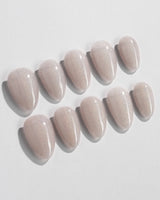 Clean Rainbow Cat-eye press-on nails in extra short almond shape — pale pink cat eye nails