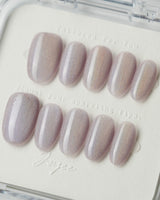 Clean Rainbow Cat-eye press-on nails in medium oval shape — pale pink cat eye nails