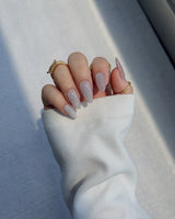 Clean Rainbow Cat-eye press-on nails in short almond shape — pale pink cat eye nails
