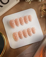 Cloud Cream press-on nails — Peach Nude, Sweet White Polka Dots. handmade nail art by Joyee Nails