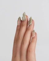 Clover Field press-on nails in short almond shape — Fresh Grass Green, Hand-painted Metallic Florals & French Pearl Outlines.