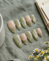 Clover Field handmade press-on nails featuring Fresh Grass Green, Hand-painted Metallic Florals & French Pearl Outlines.