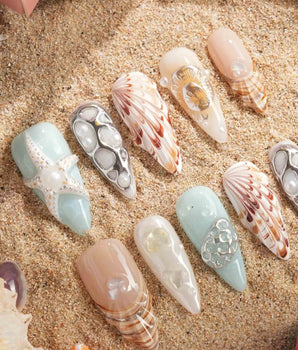 Coastline Edit handmade press-on nails featuring Azure & Nude Ocean Style, 3D Shells, Starfish & Pearls.