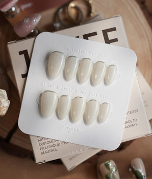 Coco Water handmade press-on nails featuring Milky Jelly White, Minimalist Silver cat eye French Tips.