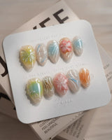 Color Rush press-on nails in extra short almond shape — Aurora Glaze Style, 3D Smudged Florals & Fluid Water Ripples.