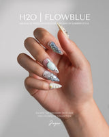 Como Blue medium stiletto nails with pearly pastels, 3D butterfly wings, and goldfish