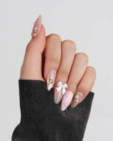 Coquette Garden nail art close-up showing Gentle Pink Gradient, 3D White Bows & Hand-painted Tulips. details