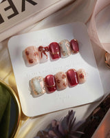 Coquette Red extra short coffin press-on nails with deep red chrome and gold bow accents