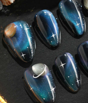 Blue galaxy press-on nails with 3D planet accent
