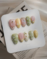 Cream Garden press-on nails in extra short almond shape — Pastoral Style, Hand-painted Bees & Wildflowers.
