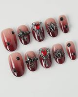 Crimson Veil press-on nails in short oval shape — Red & Black Gradient, 3D Punk Heart & Spider.