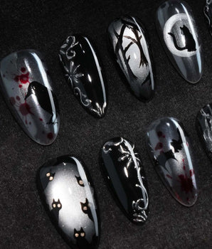 Crow Moon press on nails with a hand-painted crow on a branch, bare winter trees, black cats and bats on silver cat eye with 3D silver vines - image 1
