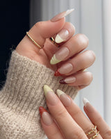Close-up of Fall Palette nails with warm autumn shades and sculpted textured French details