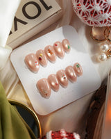 Mini Noel press-on nail set — nude cat eye christmas icons design, hand-painted with real gel polish