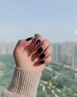 Cutting Edge nail art close-up showing Black ombre nails details