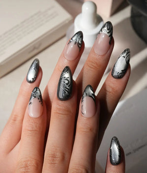 Damask press on nails with freehand black filigree scrollwork and a butterfly on nude and silver cat eye - image 2