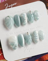 Dead Sea Blue press-on nails with Mediterranean seafoam shimmer and sculpted shell details