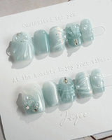 Dead Sea Blue in extra short square shape with pearl shell texture and green jelly gloss