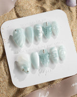 Dead Sea Blue in short stiletto shape with glossy ocean shell accents