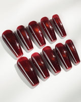 Deep Red Cat eye Nails press-on nails in long coffin shape — red cat eye christmas holiday