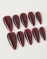 Deep Red Cat eye Nails press-on nails in medium stiletto shape — red cat eye christmas holiday