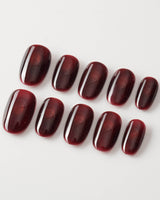 Deep Red Cat eye Nails press-on nails in short oval shape — red cat eye christmas holiday