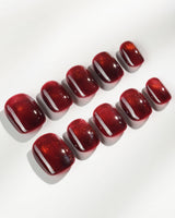 Deep Red Cat eye Nails press-on nails in extra short squoval shape — red cat eye christmas holiday