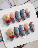 Denim Cherry glossy summer nails with denim blue French tips and bright red cherries