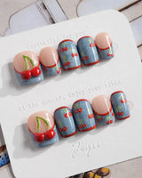 Denim Cherry medium almond press-ons with Y2K denim styling and juicy cherry motifs