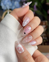 Dreamglow handmade press-ons with pearly pink shine and dreamy 3D bow accents