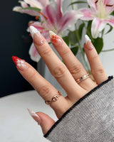 Duchess Marigold short almond press-on nails with sculpted orange floral tips