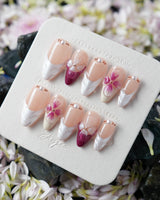 Duchess Purple short almond nails with lavender violet tones and handcrafted 3D blossoms