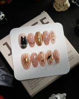 Egyptian Gold handmade press-on nails in medium oval shape by Joyee Nails