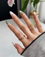 Duchess Olive nails with dimensional floral accents and refined olive French design