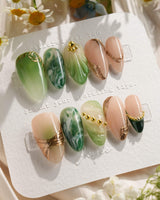 Emerald - Jade Sutra handmade press-on nails featuring Elegant Grape Green, Marble Smudge & Liquid Metal.