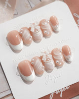 Engagement press-on nails in short oval shape — Elegant Style, Pearl Outlines & 3D Ribbon Bows.