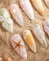 Fairy Bay medium stiletto press-on nails with 3D starfish, butterflies, and pastel flowers