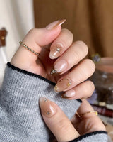 Fall Makeup press-ons with warm caramel gradient, gold wire star art, and glossy gel shine