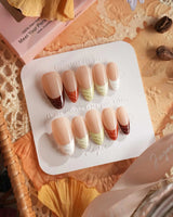 Fall Palette nail set with earthy fall colors, raised texture, and glossy French tip styling