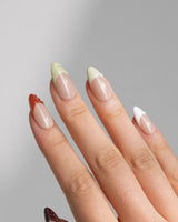 Fall Palette in medium almond shape with warm multicolor French tips and fall gel texture