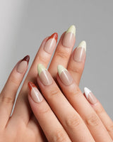 Fall Palette press-on nails with warm multicolor tones, textured French tips, and autumn gel art