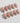 Glossy nude nails with cherry blossom petal design