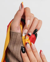 FIFA Germany game day nails with graphic flag bands and gold glitter detail