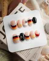 FIFA Germany extra short oval nails with graphic soccer flag stripe accents