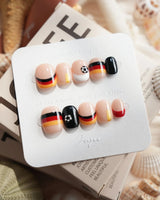 FIFA Germany extra short squoval press-ons with tricolor World Cup nail art