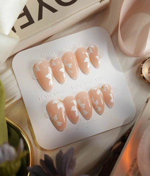 Fleur Fantasy handmade press-on nails featuring white floral french tip nails