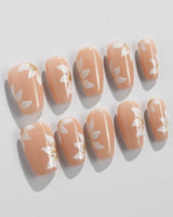 Fleur Fantasy nail art close-up showing white floral french tip nails details