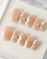 Fleur Fantasy press-on nails in short oval shape — white floral french tip nails