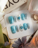 Frozen Dream press-on nails — ice blue ombre silver chrome snowflake charm handmade nail art by Joyee Nails
