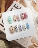 Gelato Dot short oval press-on nails with chrome and metallic dot accents